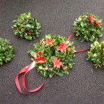 Christmas grave posies and holly wreaths